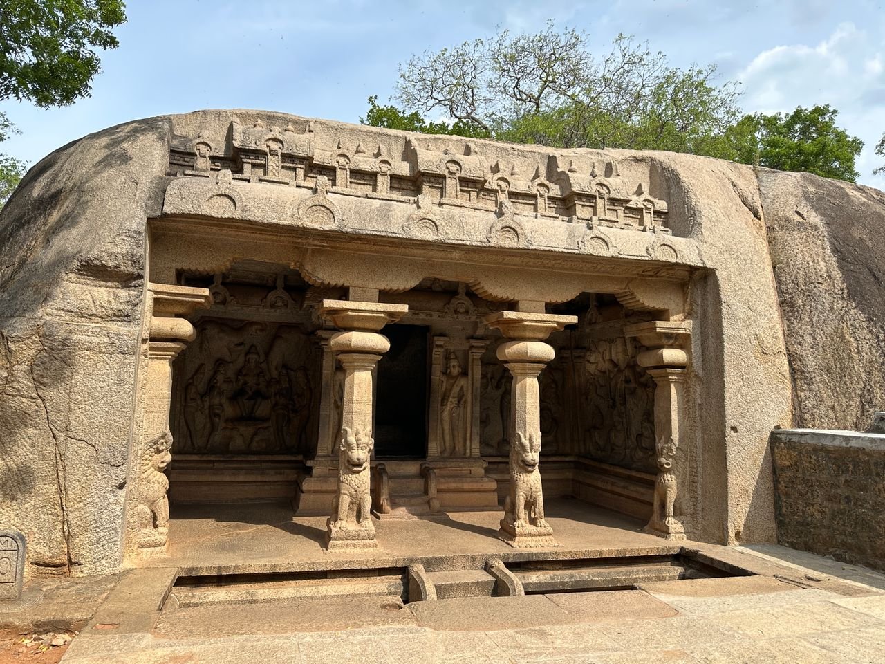 Stone-carved temple entrance in Mahabalipuram, showcasing intricate architecture.